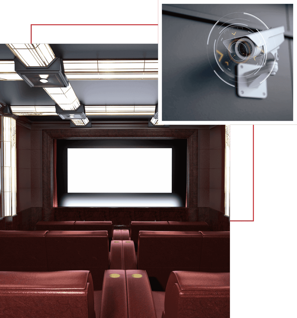 Empty movie theater with a security camera monitoring the area.