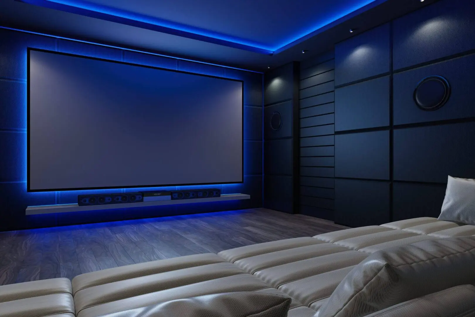 Modern home theater room with blue ambient lighting and comfortable seating.