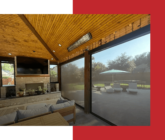 Cozy outdoor seating area with wooden ceiling and large windows.