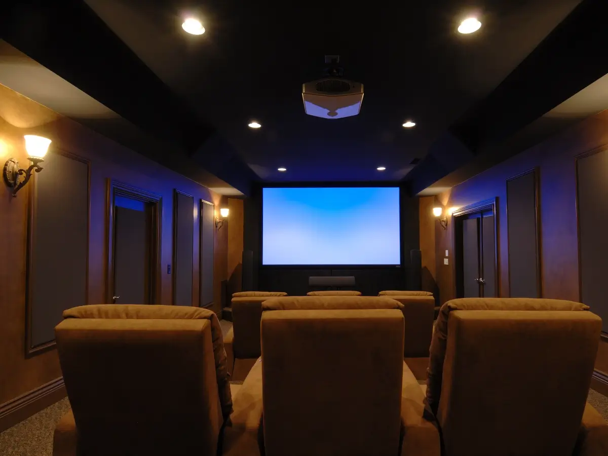 Home theater with empty seats and screen.