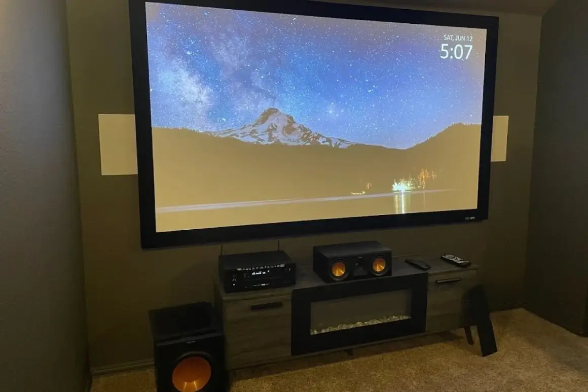 Home theater setup with large screen display.