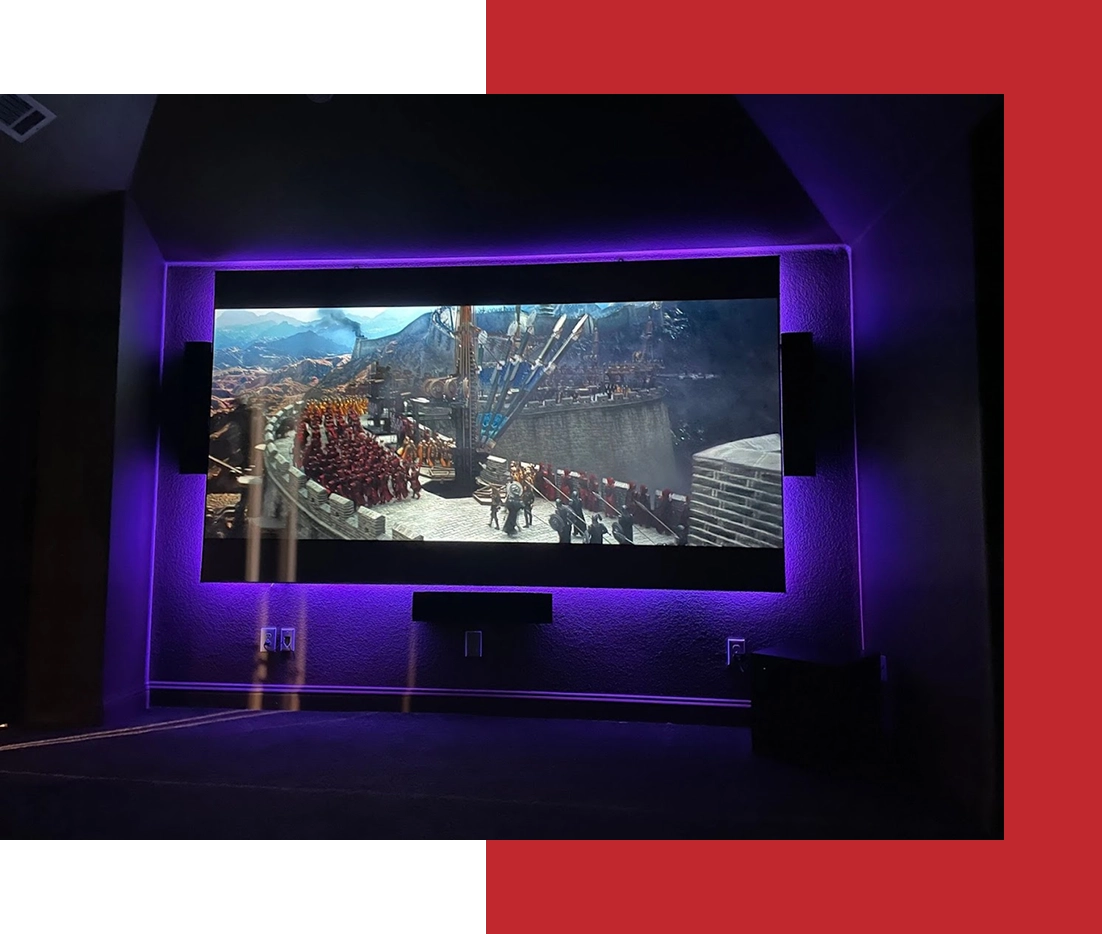 Home theater screen with purple ambient lighting.