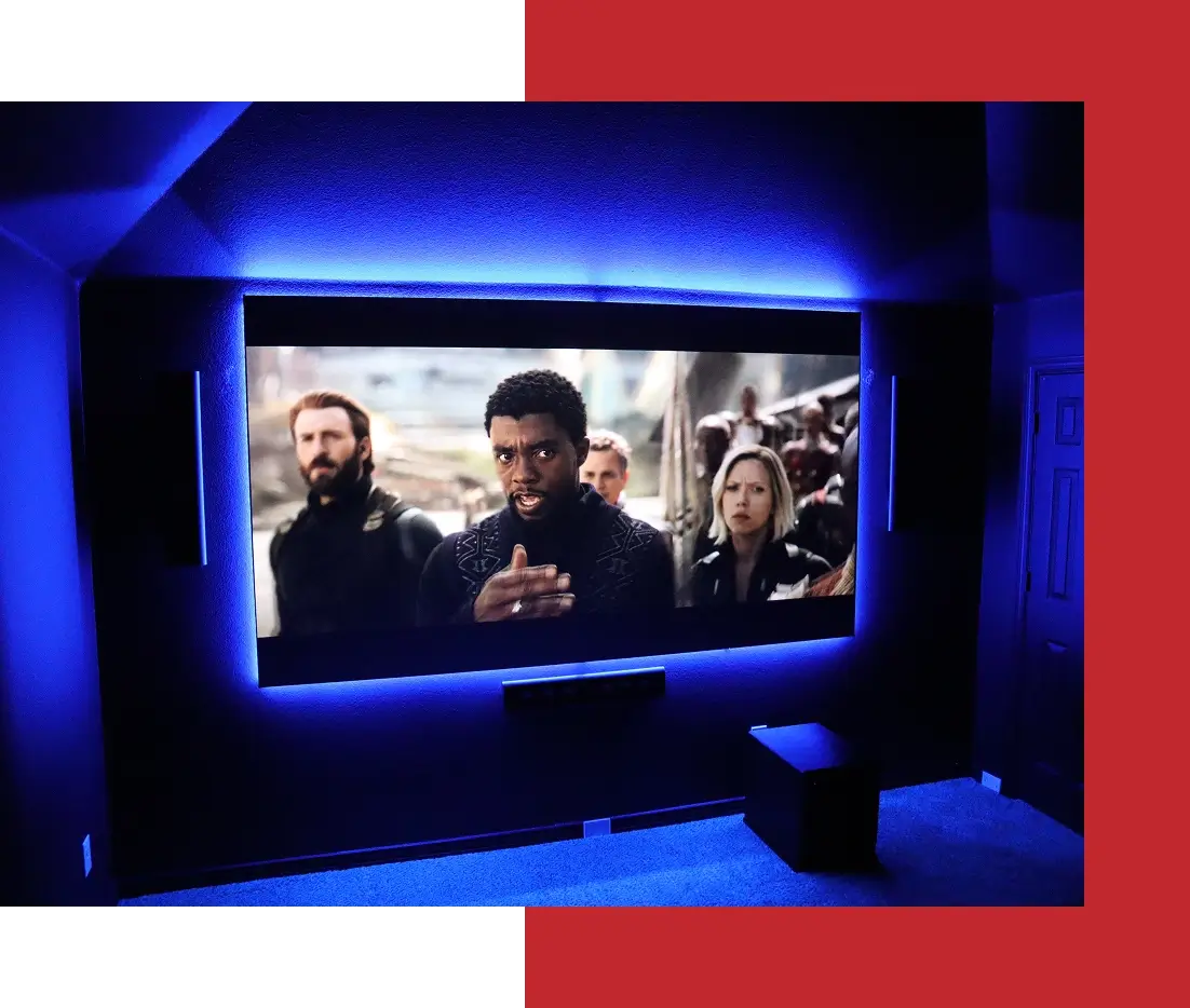 Home theater with movie on large screen.