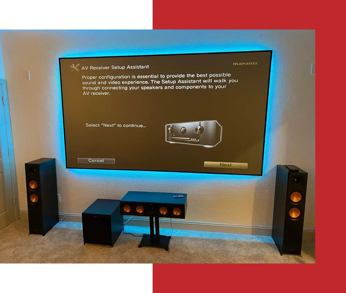 Home theater setup with speakers and screen.