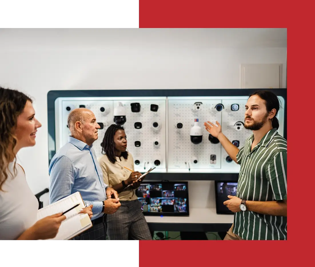 People discussing security cameras in a meeting.