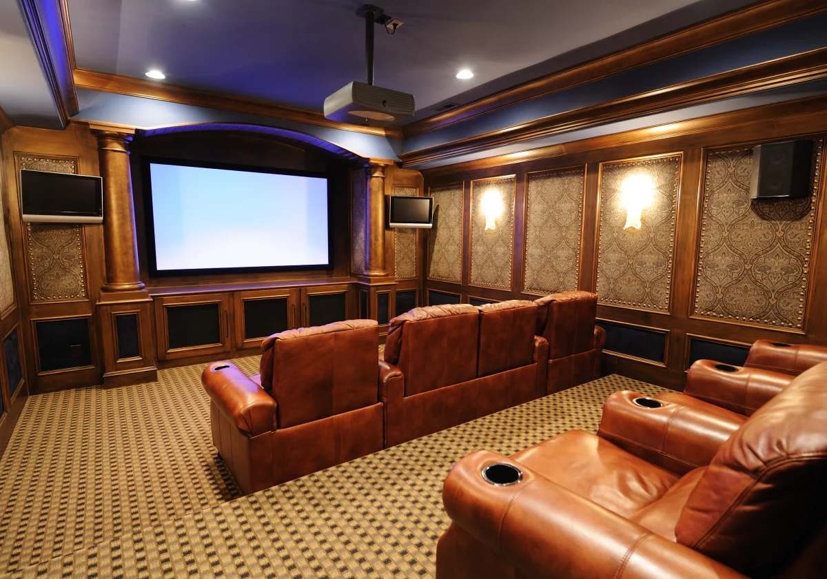 Home theater with brown leather seats.